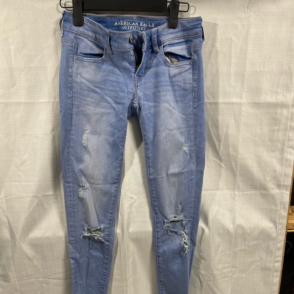 American Eagle super stretch super low jean jeggings rips ankle fringe size 4 - Picture 2 of 5
